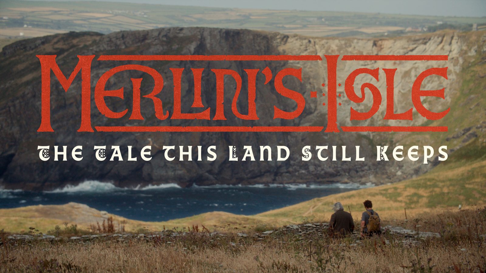 Merlin's Isle: The Tale This Land Still Keeps title card over the Cornish coast